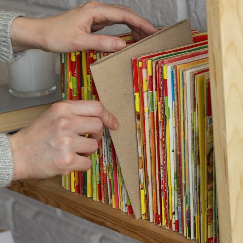 stack-old-coming-book-strips-wooden-shelf